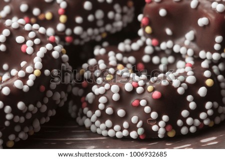 Similar – Dot on chocolate Candy