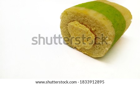 Cake roll with durian flovoured cream on white background.