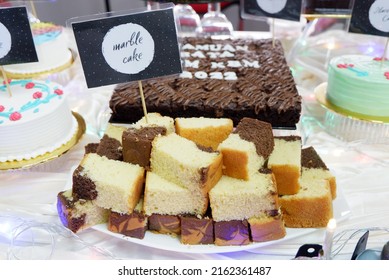 the cake in selective focus with the label of the cake name 