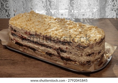 Cake without an oven, biscuits layered with currant jam and caramel cream