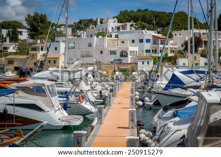 Cala D'Or yacht marina pier with recreational boats. Mallorca, Spain