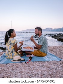 Cala Gonone Sardinia Italy Augist 2019, Young Couple Eating Pizza On The Beach 