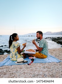 Cala Gonone Sardinia Italy Augist 2019, Young Couple Eating Pizza On The Beach 