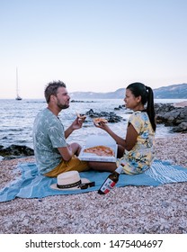 Cala Gonone Sardinia Italy Augist 2019, Young Couple Eating Pizza On The Beach 