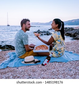 Cala Gonone Sardinia Italy Young Couple Eating Pizza On The Beach , Happy Guy And Girl Eating Pizza