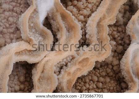 Calcite. Surface structure close-up. Naturally occurring form of calcium carbonate.