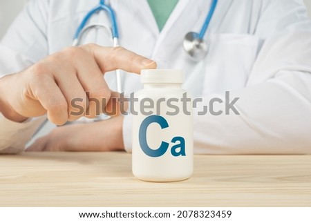 Calcium Ca supplements for Bone human health. Doctor recommends taking calcium Ca. doctor talks about Benefits of calcium. Essential vitamins and minerals for humans. Calcium Health Concept.