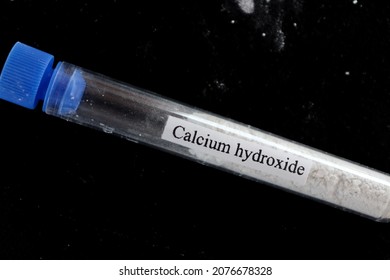 Calcium Hydroxide In Test Tube And Black Background