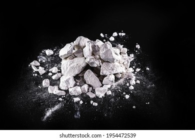 Calcium and Magnesium stones, black background. Called virgin lime or quicklime