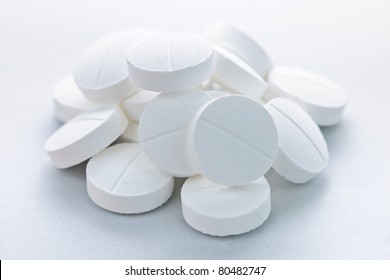 Calcium Supplement Pills In A Pile Closeup