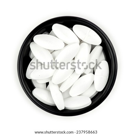 Calcium supplement tablet pills isolated on white