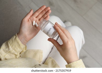 Calcium Supplement. Woman Taking Pills Indoors, Top View