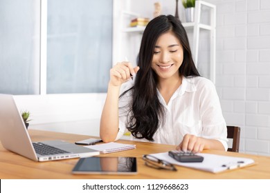 calculate,finance,accounting,Business people analyzing investment charts with calculator .Accounting technology,using laptop at office,Analyze plans document paper graph chart business marketing plan.