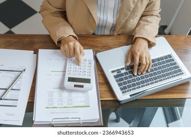 Calculating Cost Economic budget saving and investment concept analyzing investment charts and calculator Accounting  - Shutterstock ID 2366943653