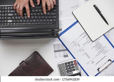 Calculating Export Import Cost. Stack Of Statistic Data, Calculator And Notepad. Detailed Reviewing Export Import Tariffs