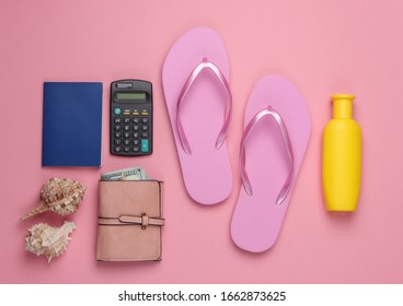 Calculation of the cost of rest. Summer background. Traveler, beach accessories, calculator on pink background. Top view.
