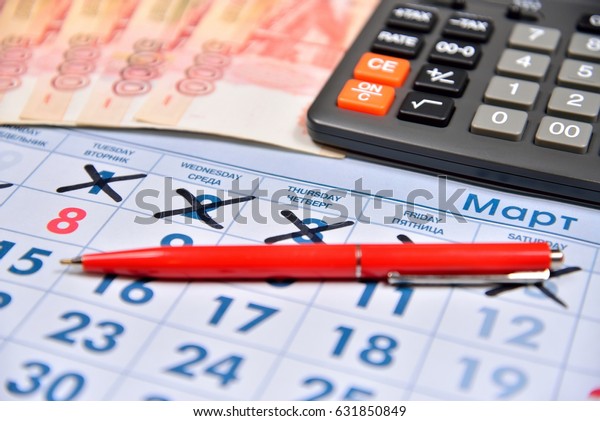 The calculation on the\
calculator and recording pen cost holiday gifts on March 8.\
Business still life