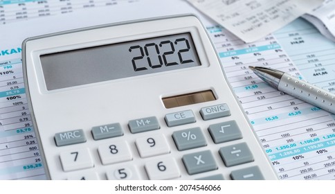 A calculator with the 2022 on the display - Shutterstock ID 2074546066