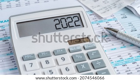 A calculator with the 2022 on the display