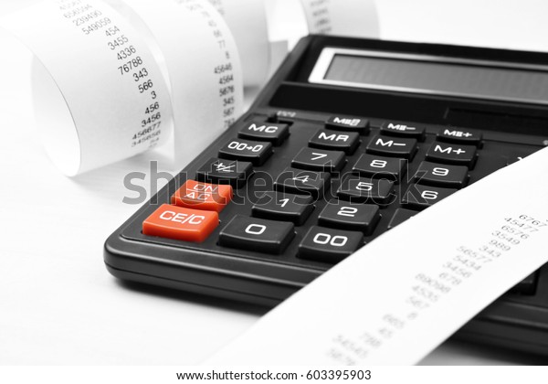 Calculator with adding\
machine tape,\
closeup