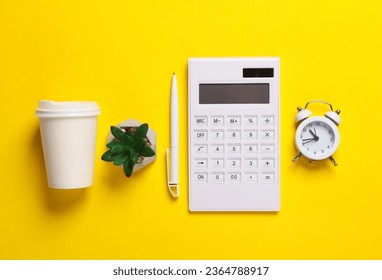 Calculator, alarm clock, pen, coffee cup and plant on yellow background. Business concept. Workspace. Top view. Flat lay - Shutterstock ID 2364788917
