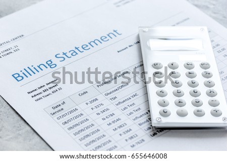 calculator, billing statement for doctor's work in medical center stone background