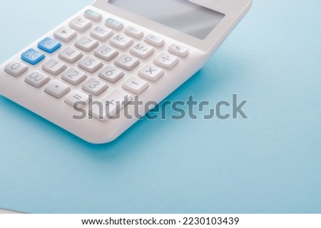 A calculator with a blue back.

The button on the calculator says 
