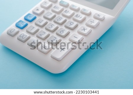 A calculator with a blue back.

The button on the calculator says 
