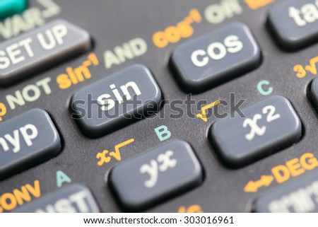 Calculator close-up shot focus on Sine, Cosine, Tangent