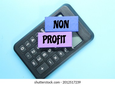 Calculator, Colored Board With The Word Non Profit