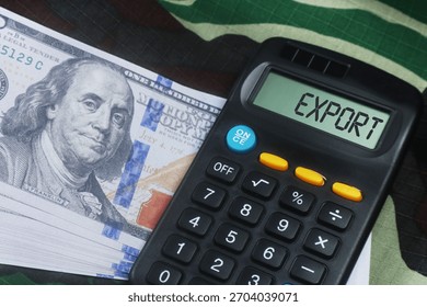 Calculator displaying export alongside a stack of US dollar bills, symbolizing international trade and finance