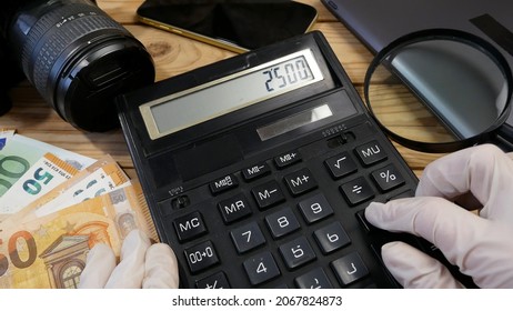 calculator,  jewellery and photo or video camera, money. Customers Buy and Sell Precious Metals, Jewels, Ancient Coins and Second Hand Electric Appliances. Closeup - Shutterstock ID 2067824873