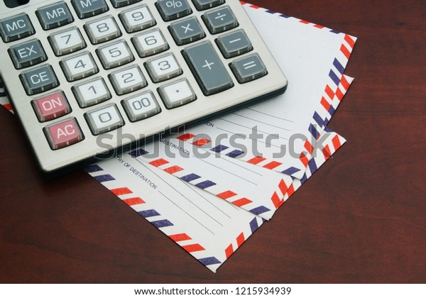 Calculator Mail Envelopes On Wooden Table Arkivfoto Rediger Na