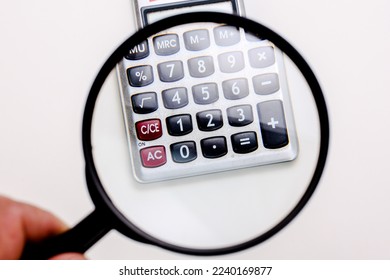 Calculator numbers under magnifier loupe