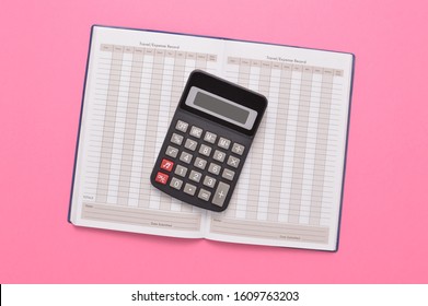 Calculator On Blank Expense Report Book On Pink Background