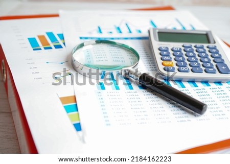 Calculator on chart and graph spreadsheet paper. Finance development, Banking Account, Statistics, Investment Analytic research data economy, Stock exchange trading, Business company concept.