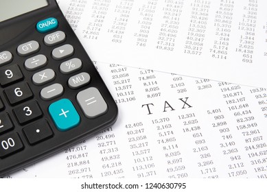 A calculator on financial chart, financial concept. - Shutterstock ID 1240630795
