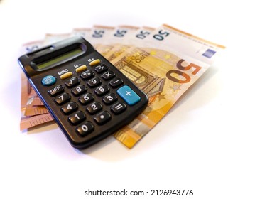 Calculator On Stack Of Euros Cash Money  ,white Background