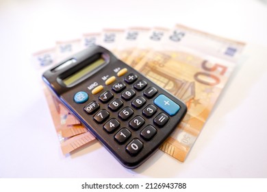 Calculator On Stack Of Euros Cash Money  ,white Background