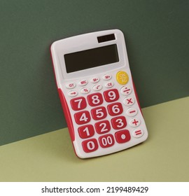 Calculator On Two Tone Green Background. Business Concept. Minimal Still Life