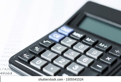 Calculator On White Paper With Numbers. Business And Finance Accounting Concept.