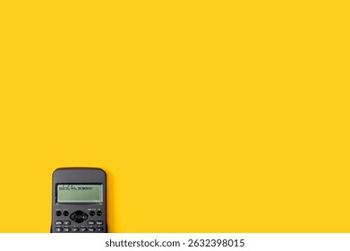 Calculator on the yellow background. Back to school flat lay. Space for text. - Powered by Shutterstock - Get 15% off with code: PIKWIZARD15