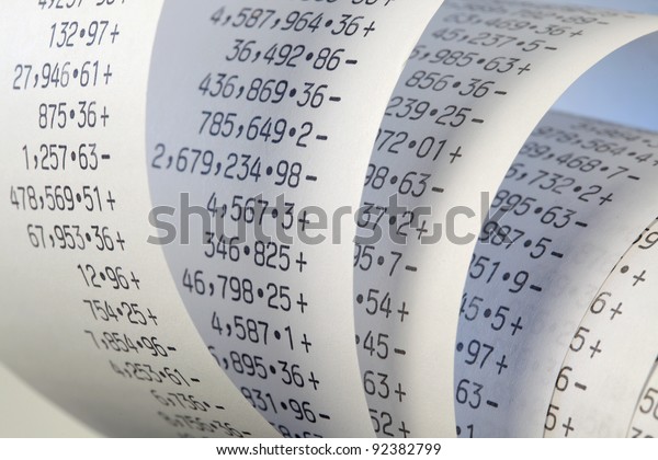 Calculator paper tape rolled\
up