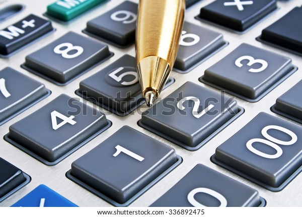 Calculator and pen, close\
up