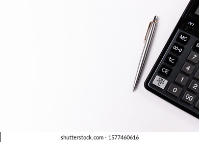 Calculator And Pen Isolated On White Background