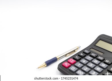 Calculator And Pen Isolated On White Background. The Machine Is Made Of Plastic. There Is A Numeric Keypad. Used To Calculate Mathematics Or Financial Accounting. And Use A Pen To Take Notes