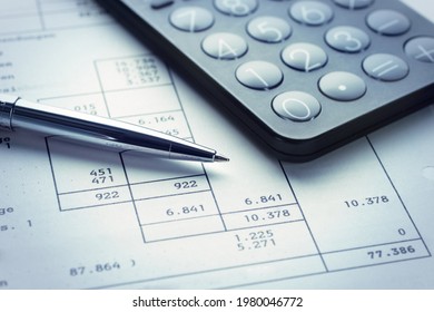 Calculator with pen and tax form