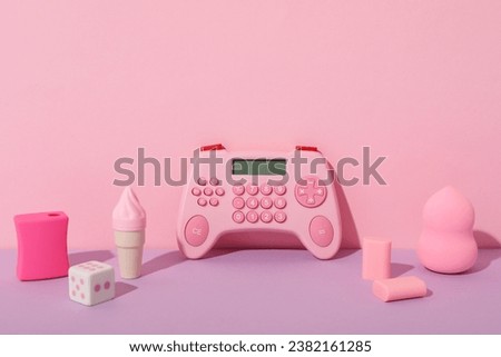 Calculator, stationery and cosmetic sponge on pink background, space for text