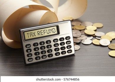 Calculator with text  Calculator, Business, finance, banking conceptual.calculator with adding machine paper with coins surround
