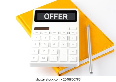 Calculator With The Text OFFER On The Display On The Notebook